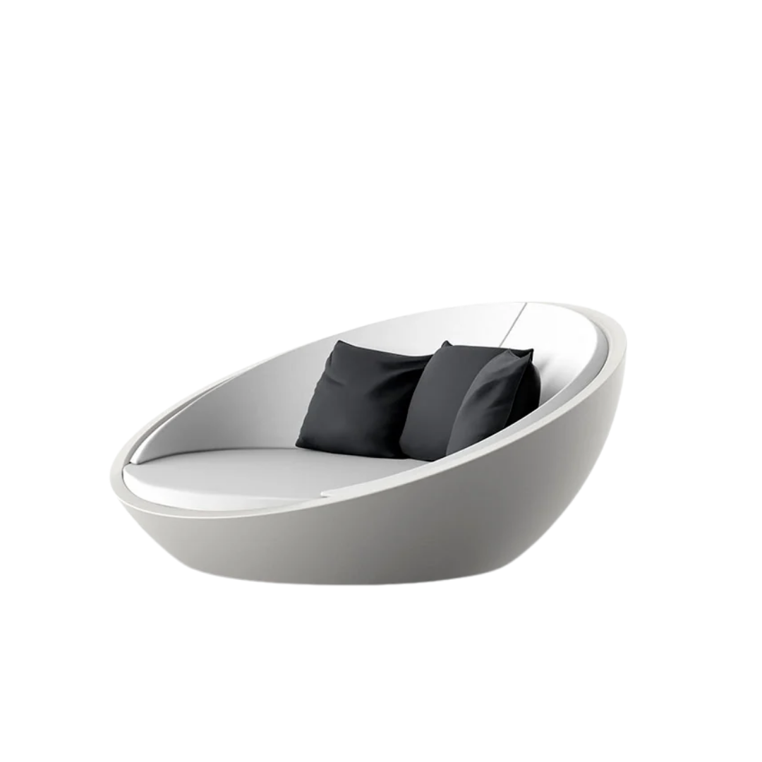 Vondom Ulm round outdoor daybed in White styled with black accent pillows