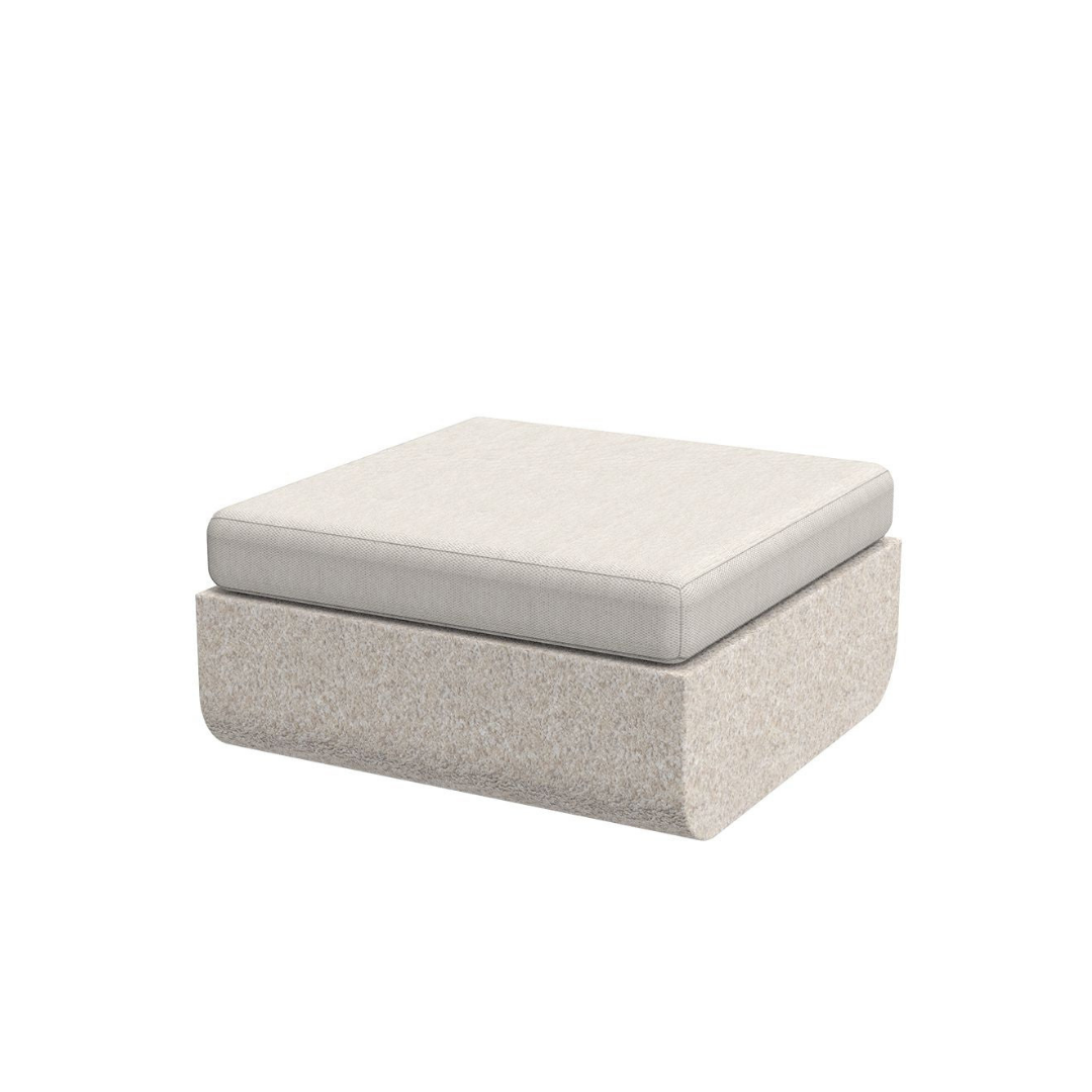 Vondom Ulm outdoor ottoman in Ecru Granite textured finish with white cushion, angled view
