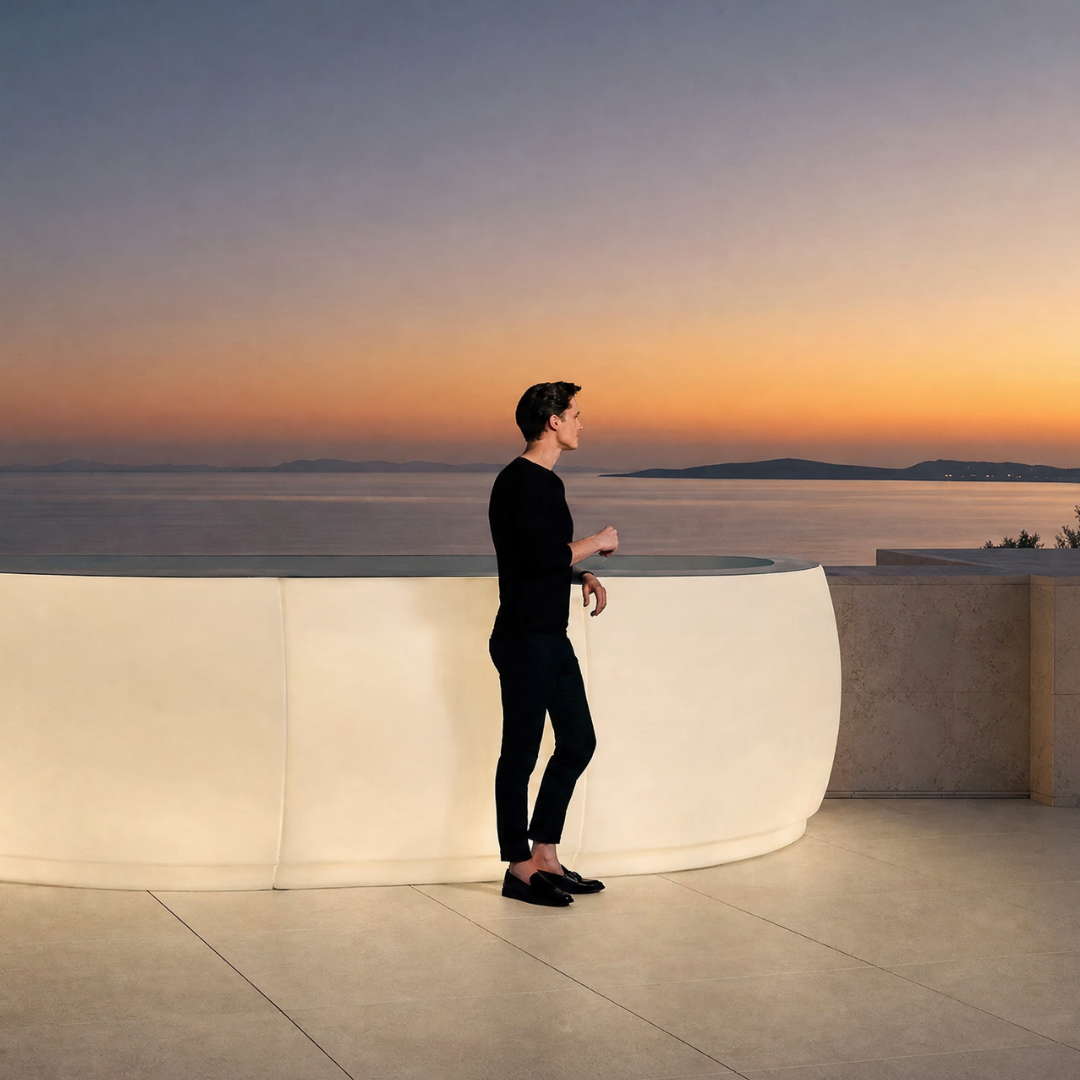 Vondom Fiesta illuminated outdoor bar counter on a rooftop terrace at sunset